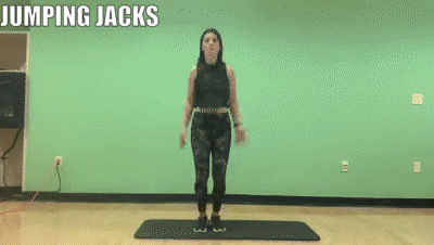 woman demonstrating jumping jacks