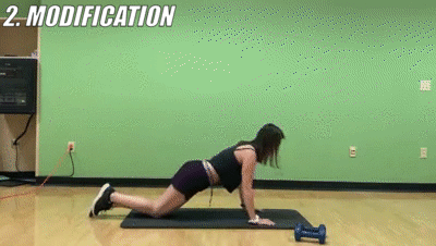 woman demonstrating modified push ups
