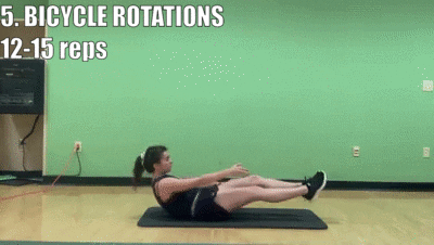 woman demonstrating bicycle rotations for 12-15 reps