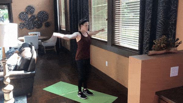 woman demonstrating lunge with arm circles