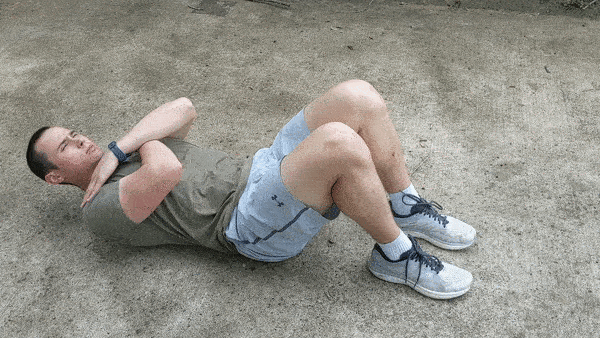 man demonstrating modified crunches