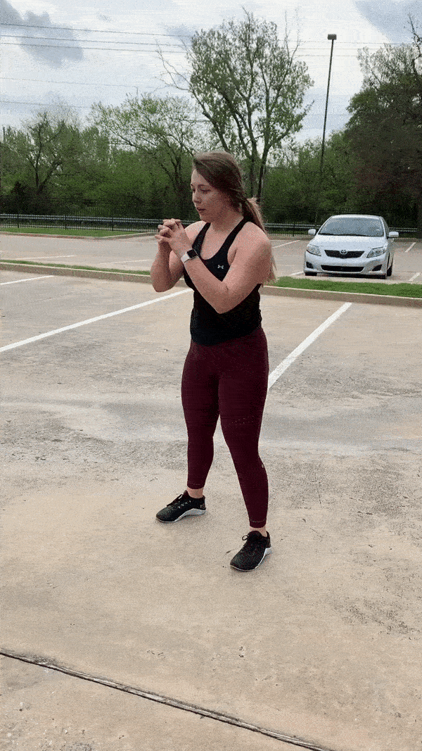 female demonstrating modified kneel to squat jump