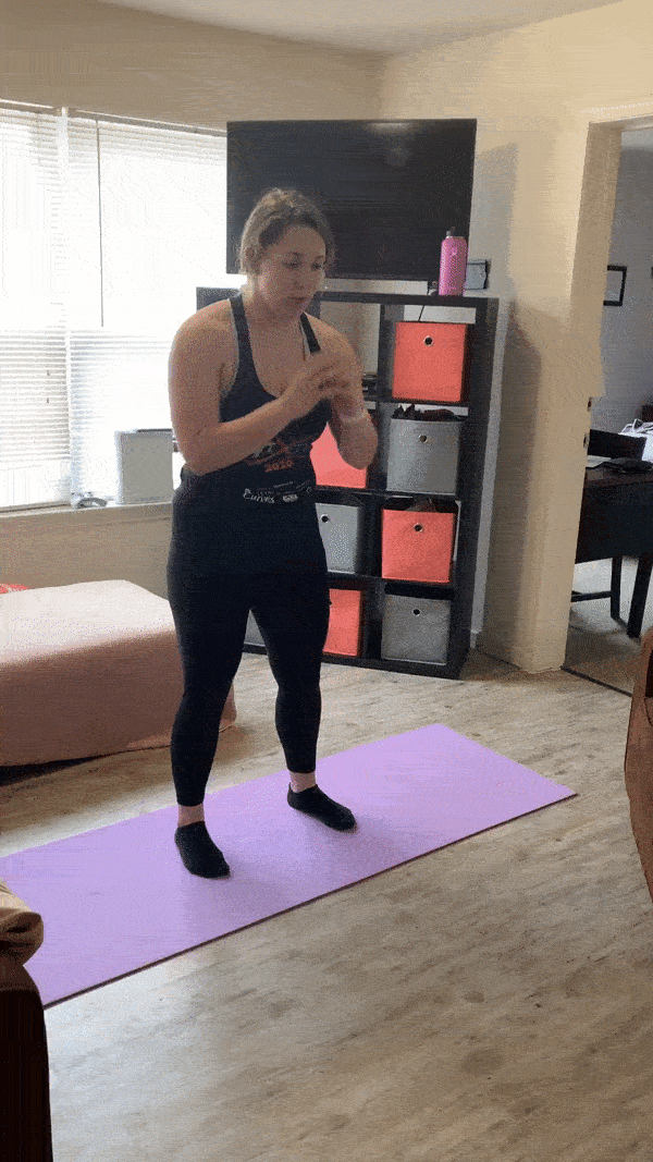 woman demonstrating modified squat jumps