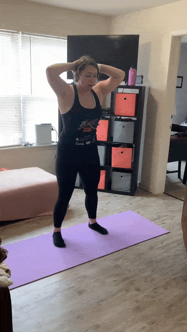 woman demonstrating squat oblique crunch