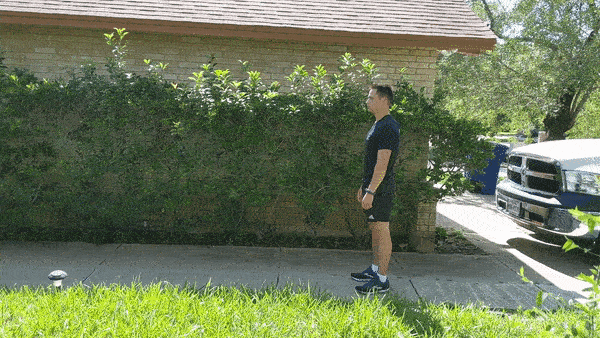 male demonstrating straight leg kicks while walking