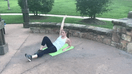 woman demonstrating supported single leg v-up modification