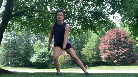 woman demonstrating lateral lunge jumps modification
