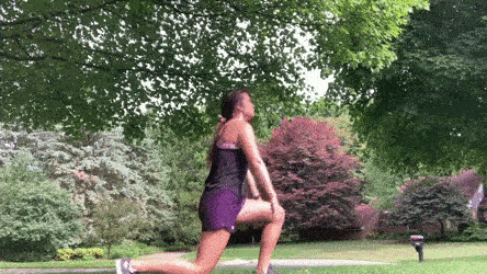female demonstrating reverse lunge to back stretch