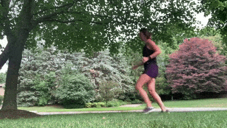 woman demonstrating forward sprint backward jog burpee modification