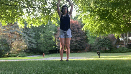 female demonstrating vertical arm swings