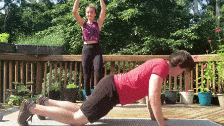 female and male demonstrating spiderman push ups and jumping jacks modification