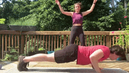 female and male demonstrating spiderman push ups and jumping jacks