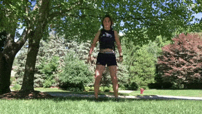 female demonstrating tuck jump modification