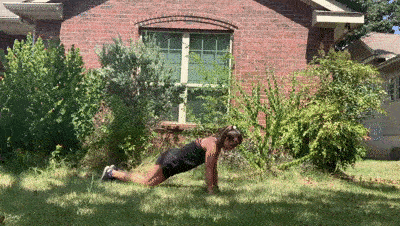 female demonstrating modified push up + pulse