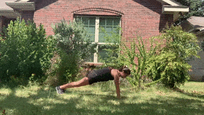 female demonstrating plank up downs