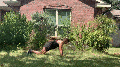 female demonstrating modified plank up downs