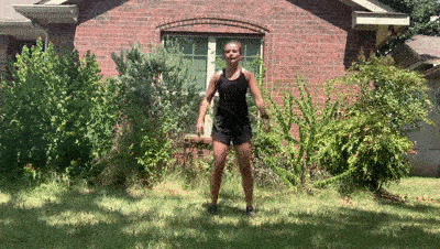 female demonstrating modified squat jump + lateral leg raise