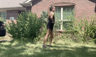 female demonstrating leg swings