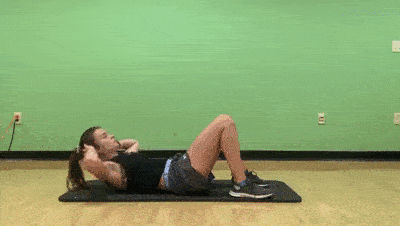 female demonstrating modified 3 crunches 3 reverse crunches