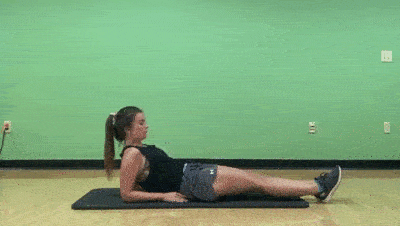 female demonstrating modified slow leg lifts