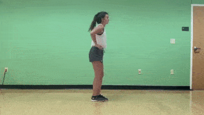 female demonstrating modified alternating reverse lunge to airplane
