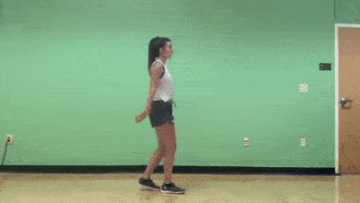 female demonstrating toe touches