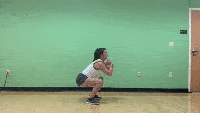 female demonstrating squat 4 punches