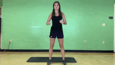 female demonstrating modified squat + pulse