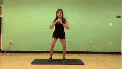 female demonstrating modified squat jump to step back